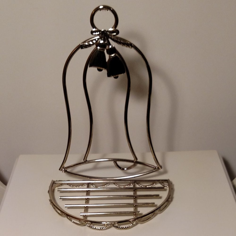 Bell shaped, gold tone metal, semi-circle shelf in excellent condition